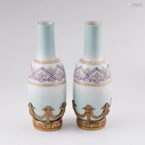 Antique porcelain vases in gilt bronze setting