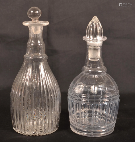 Two Early Blown Colorless Glass Stoppered Decanters.