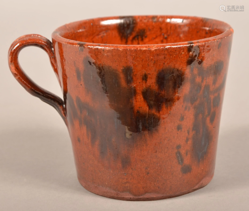 Pennsylvania 19th Century Mottle Glazed Redware Mug.