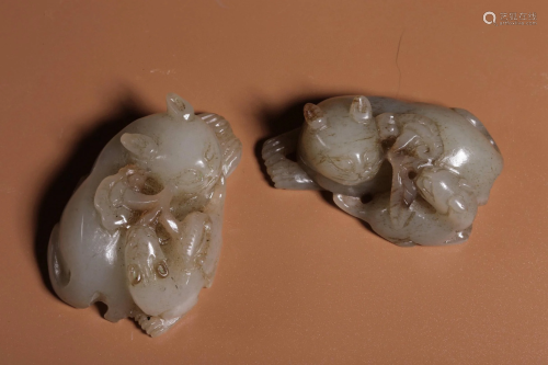A Pair of Qing Dynasty White Jade Beast Mother and