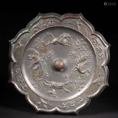 A BRONZE MIRROR WITH ANIMAL PATTERN 