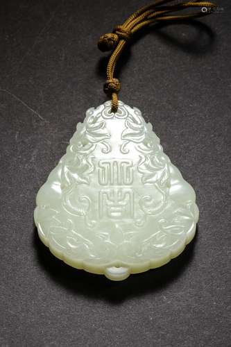 A YELLOW JADE PLAQUE