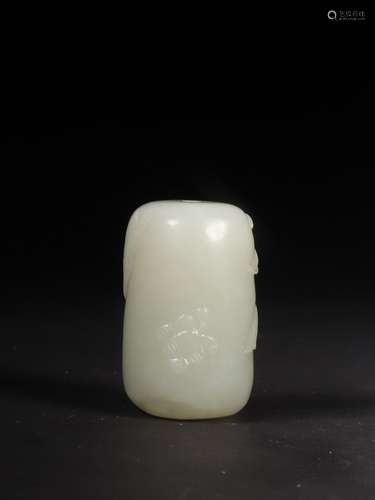 A JADE BUTTERFLY AND FLOWER  BARREL SHAPED BEAD