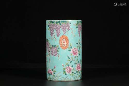 A TURQUOISE-GROUND FAMILLE ROSE FLOWR AND BIRD BRUSH POT