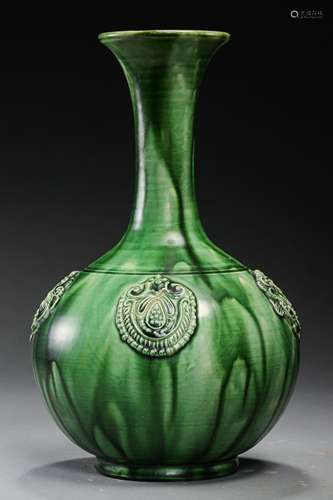 A GREEN-GLAZED VASE 