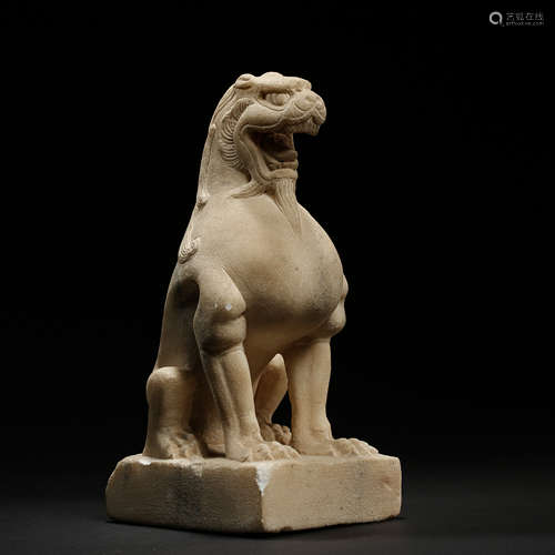 A WHITE MARBLE FIGURE A LION 