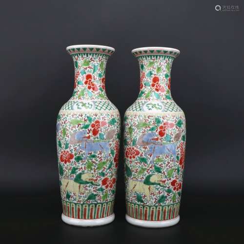 A pair of Wu cai 'beast' vase
