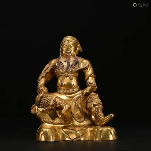 A gilt-bronze statue of Guangong