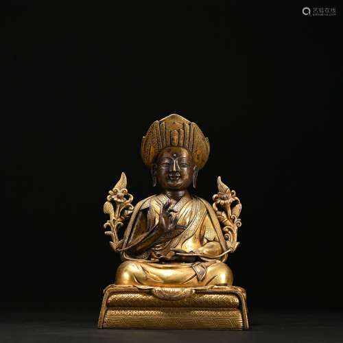A gilt-bronze statue of Master Buddha
