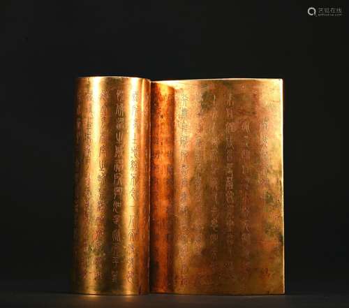 A gilt-bronze book