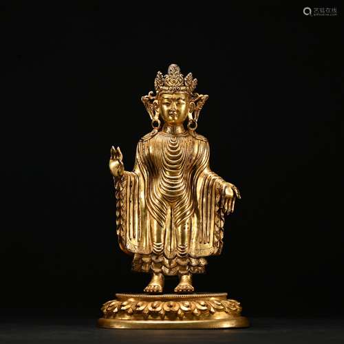 A gilt-bronze statue of buddha