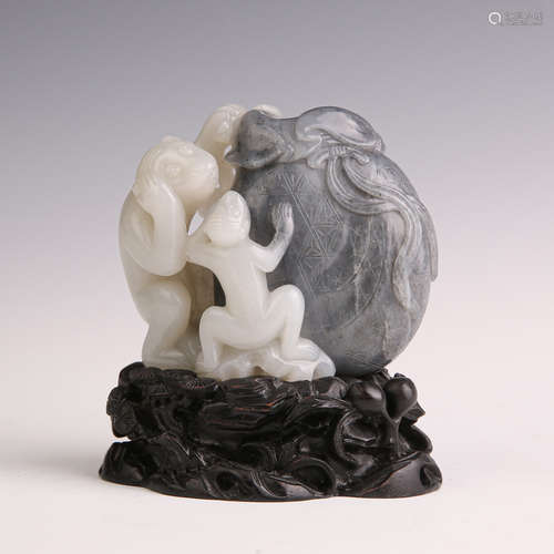 A Blue and White Jade Monkey with Fabric Poacket Figure Orna...