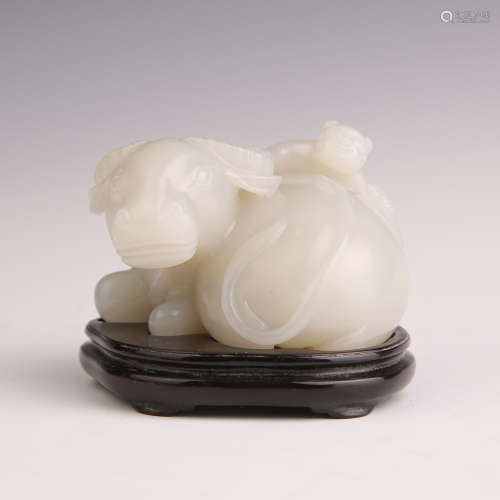 A White Jade Child with Ox Ornament