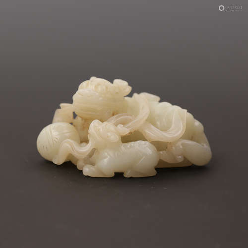 A White Jade Double Lion Ornament