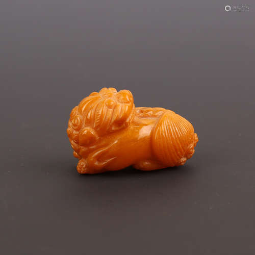 A Beeswax Carved Lion Ornament