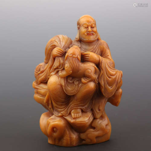 A Tianhuang Stone Carved Lohan with Beast Ornament