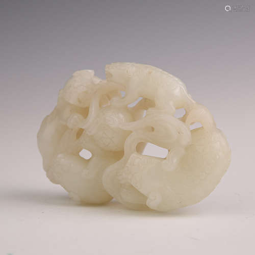 A White Jade Four Lions Ornament