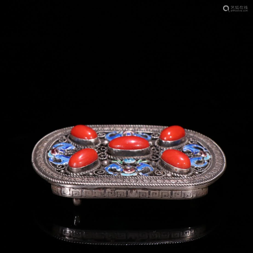 A CORAL INLAID SILVER ENAMELED BELT BUCKLET.