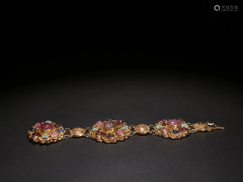 A TOURMALINE INLAID GILT FILIGREE BRACELET