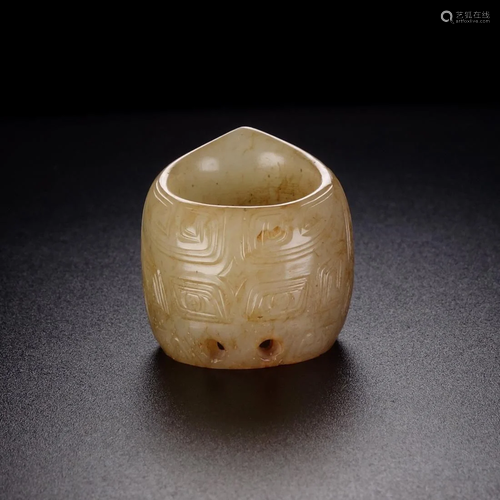 A 'TAOTIE' RELIEFS WHITE JADE THUMB RING