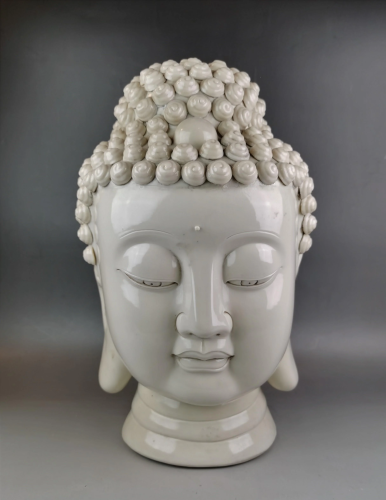 A Chinese white glazed head of Buddha