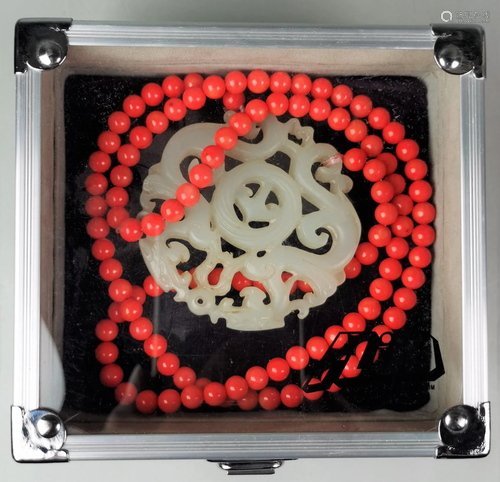 A Chinese red coral necklace with hetian white jade