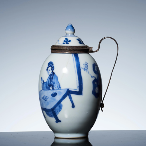 Silver handle teapots with blue and white figures in