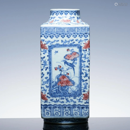 Blue and white square vase with windows and flowers and