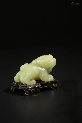 A yellow jade carving of a kylin, presumably Qing
