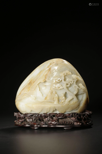 A russet and celadon jade carving of figures under a