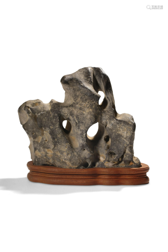 A Chinese Lingbi scholar's rock depicting mountains, W