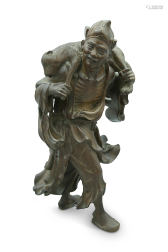 A woodcarving of a Luohan, H 30 cm