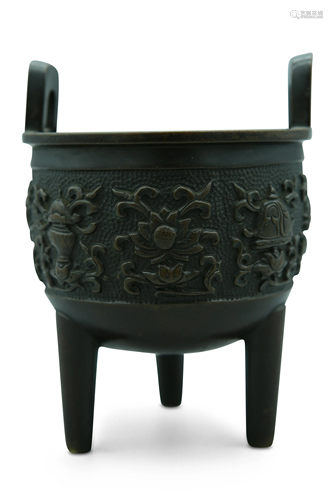 A bronze tripod censer, high-relief carved with the