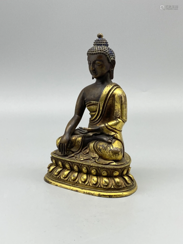 A Sino-Tibetan gilt-bronze figure of Shakyamuni Buddha