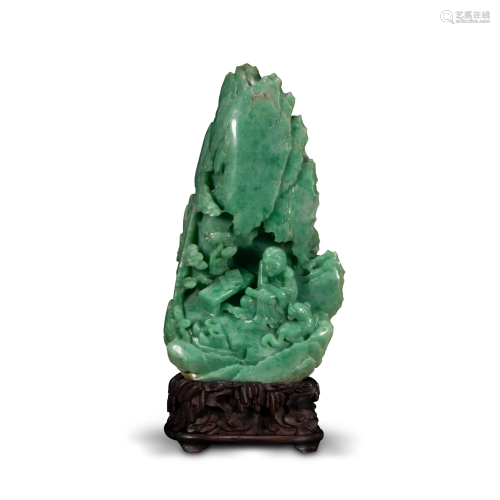 An emerald jade carving group of a figure in a