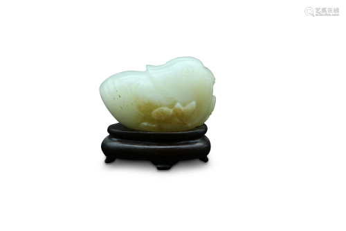 A russet and white jade carving of a
