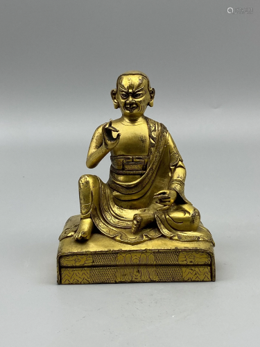 A Chinese gilt bronze figure of Luohan, H 14,5