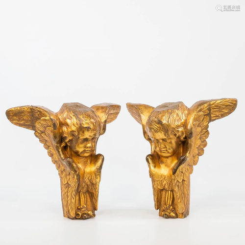 A pair of figurative gilt wood corbels, a pair of