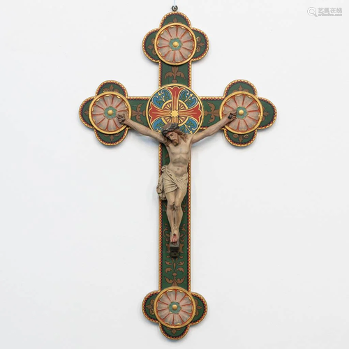 A richly decorated crucifix with plaster corpus, 19th