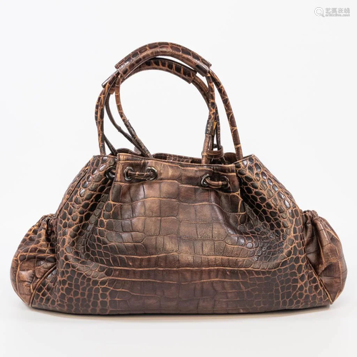 A Giorgio Armani handbag made of alligator leather.