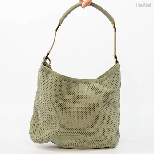 A Delvaux handbag, made in green perforated suede