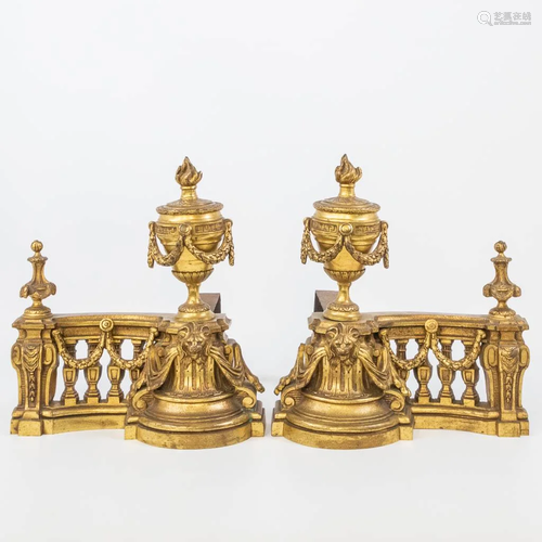 A set of fireplace bucks made of bronze and metal, in