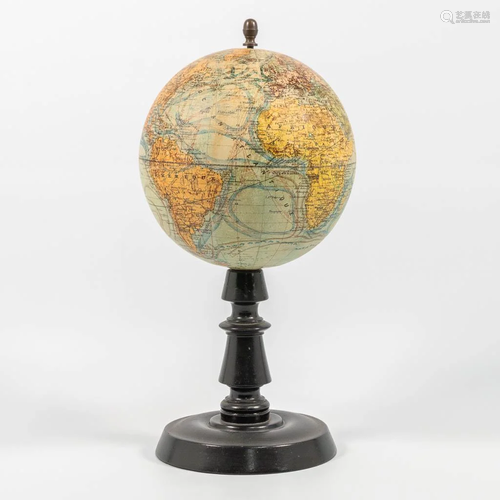 A globe on wood base, marked: 'J. Forest - Globe