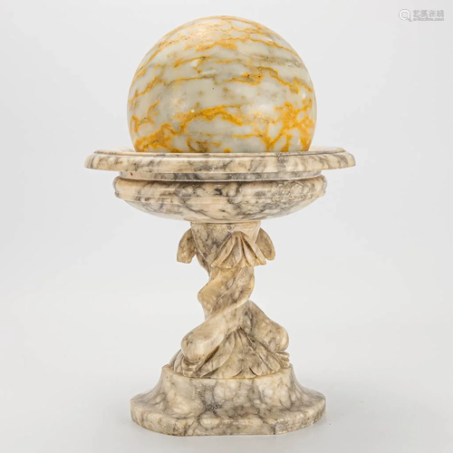 A Tazza made of Alabaster and a sphere made of marble.