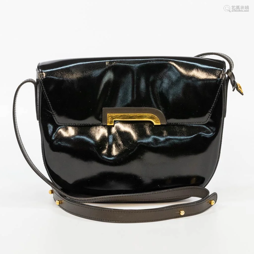 A Delvaux handbag, made of black leather with gold