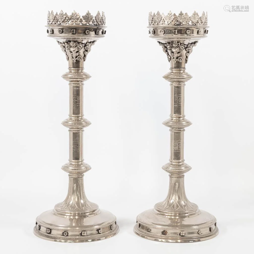 A pair of silver-plated church candlesticks, decorated