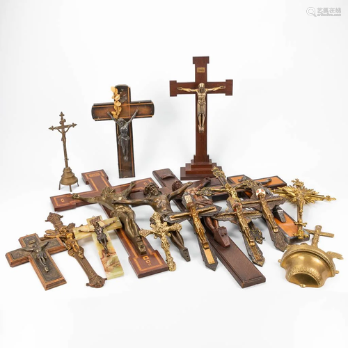 A collection of 16 crucifixes, made of wood, brass and