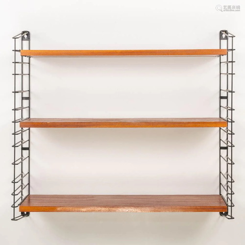 A mid-century Tomado wall rack, made of wood and metal.