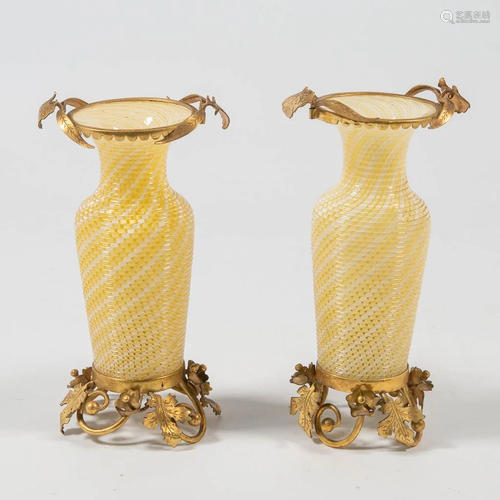 A pair of vases made of glass and mounted with bronze,