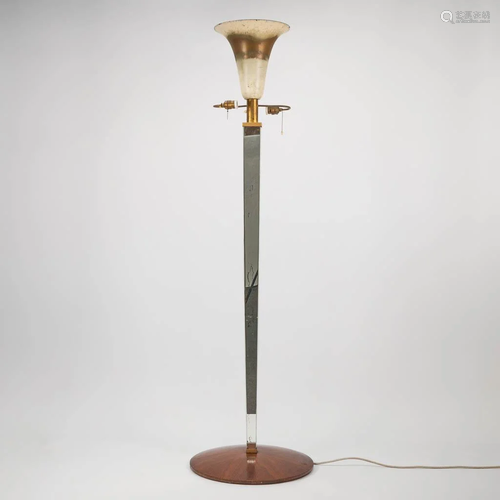 A standing floor lamp made of brass, mirrors on a wood